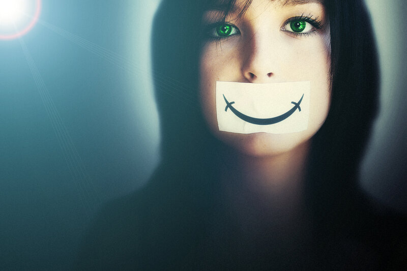 woman with taped smile