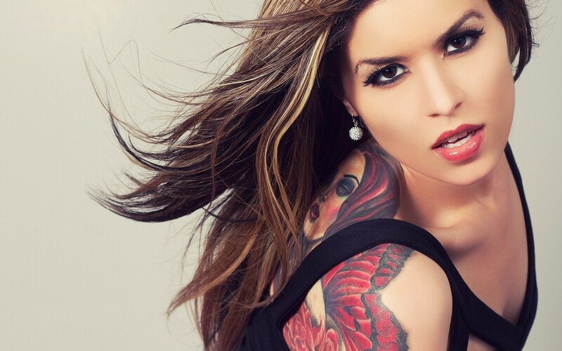 woman with tattoo and flowing hair