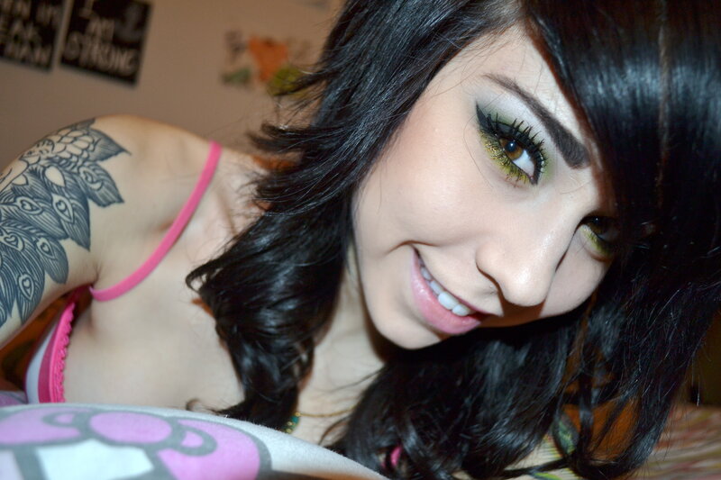 woman with tattoo and makeup