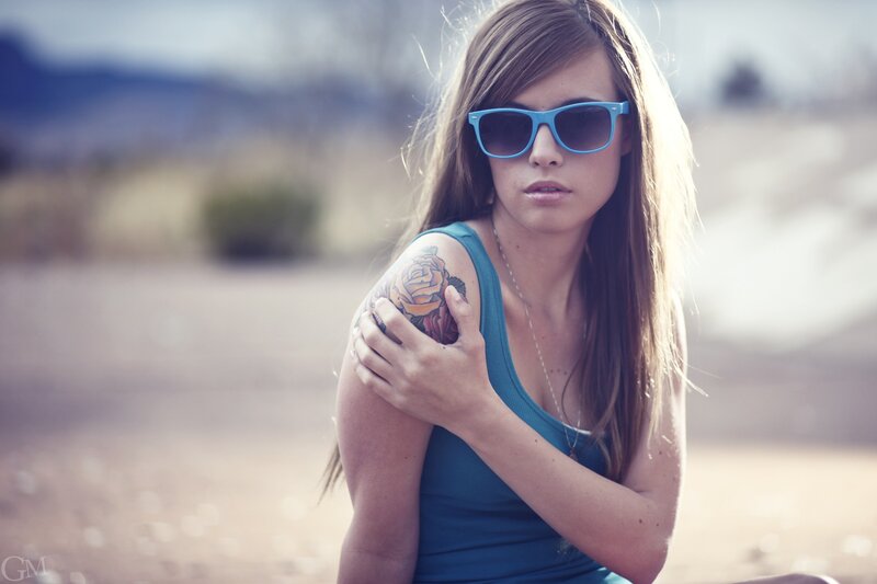 woman with tattoo and sunglasses