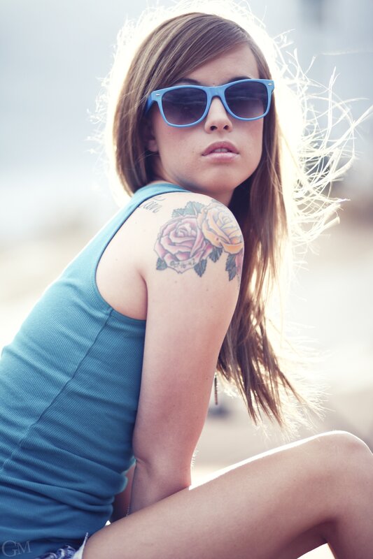 woman with tattoo and sunglasses