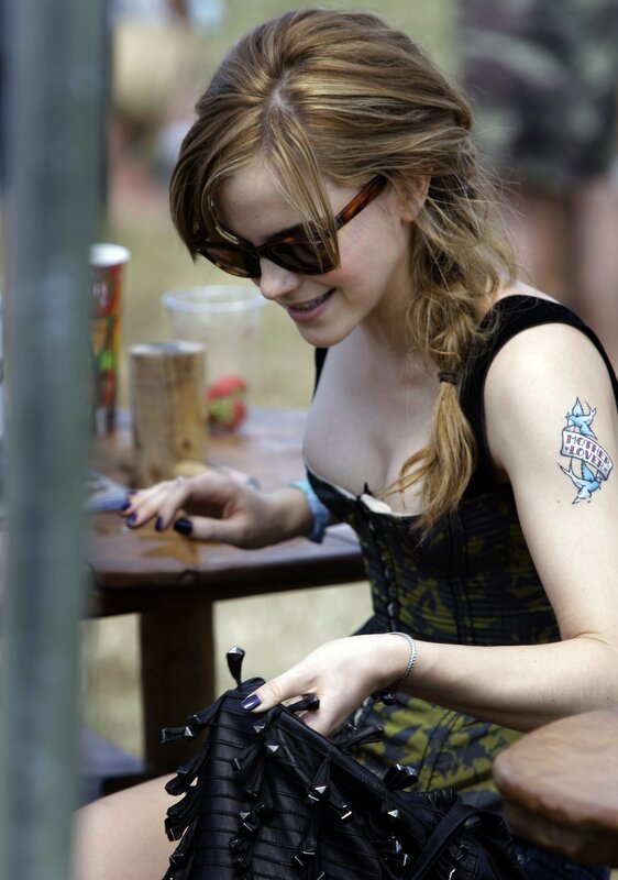 woman with tattoo at outdoor table