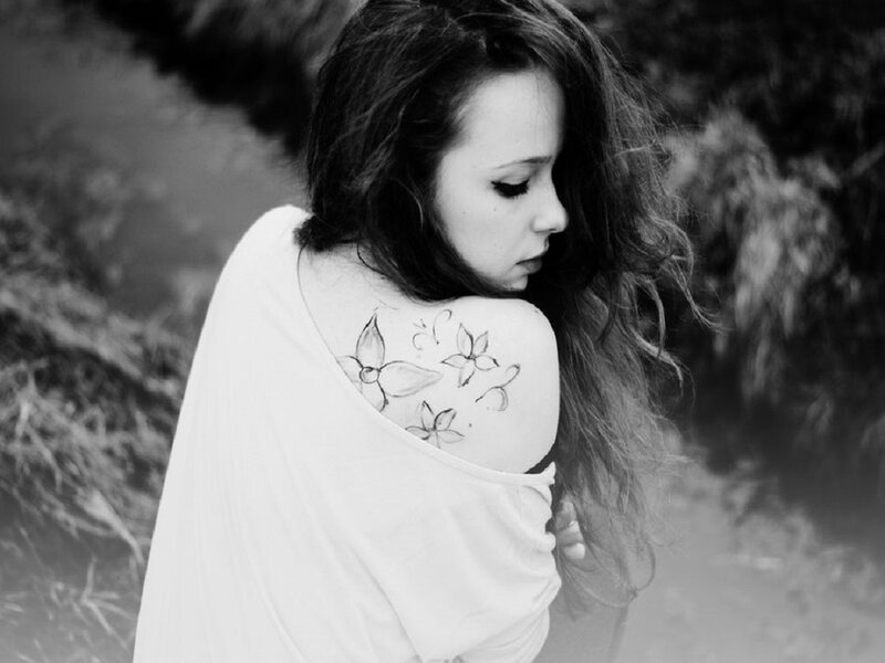 Woman with Tattoo — Black, Melancholic, Photograph