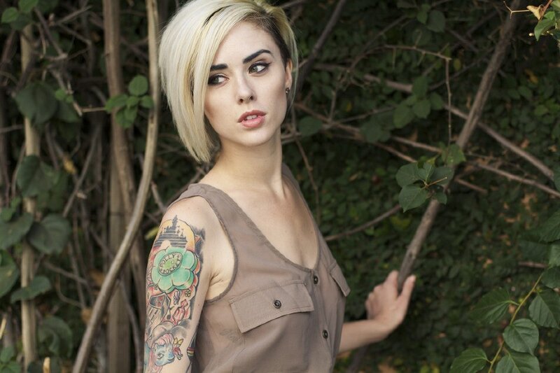 woman with tattoo in garden