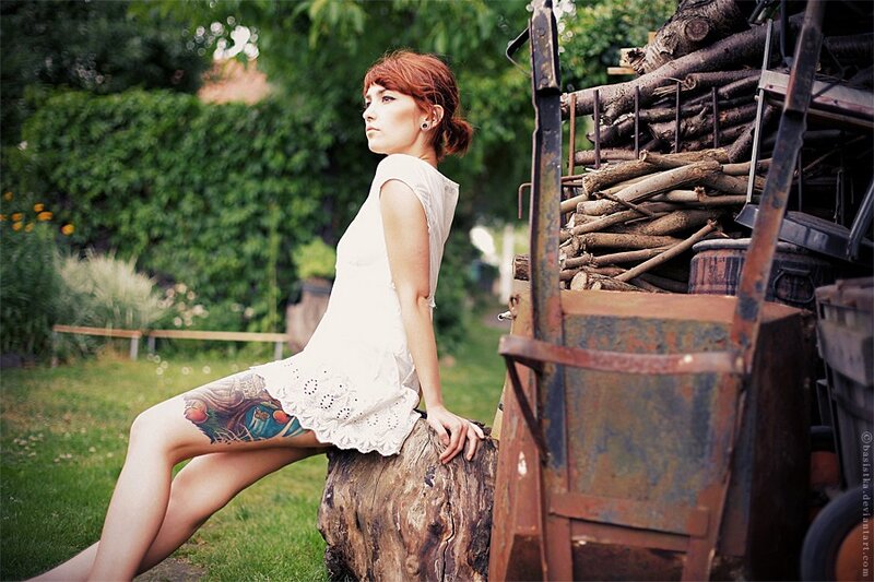Woman with tattoo in garden