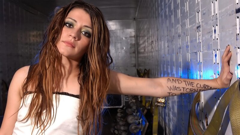 woman with tattoo in warehouse