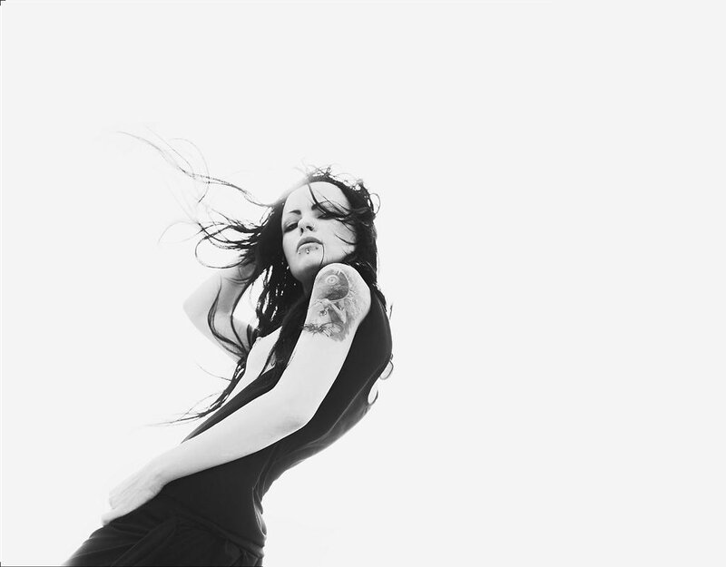 woman with tattoo in wind