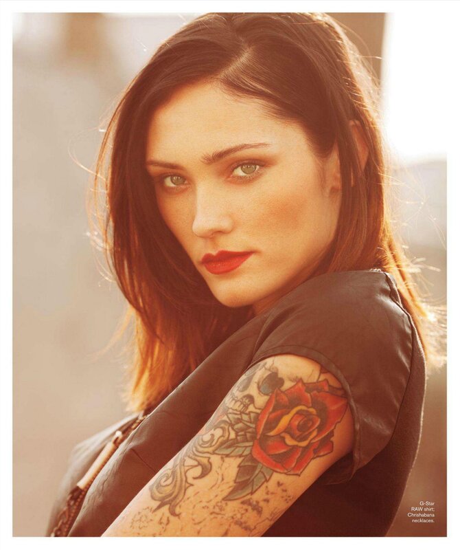 woman with tattoo looking at camera