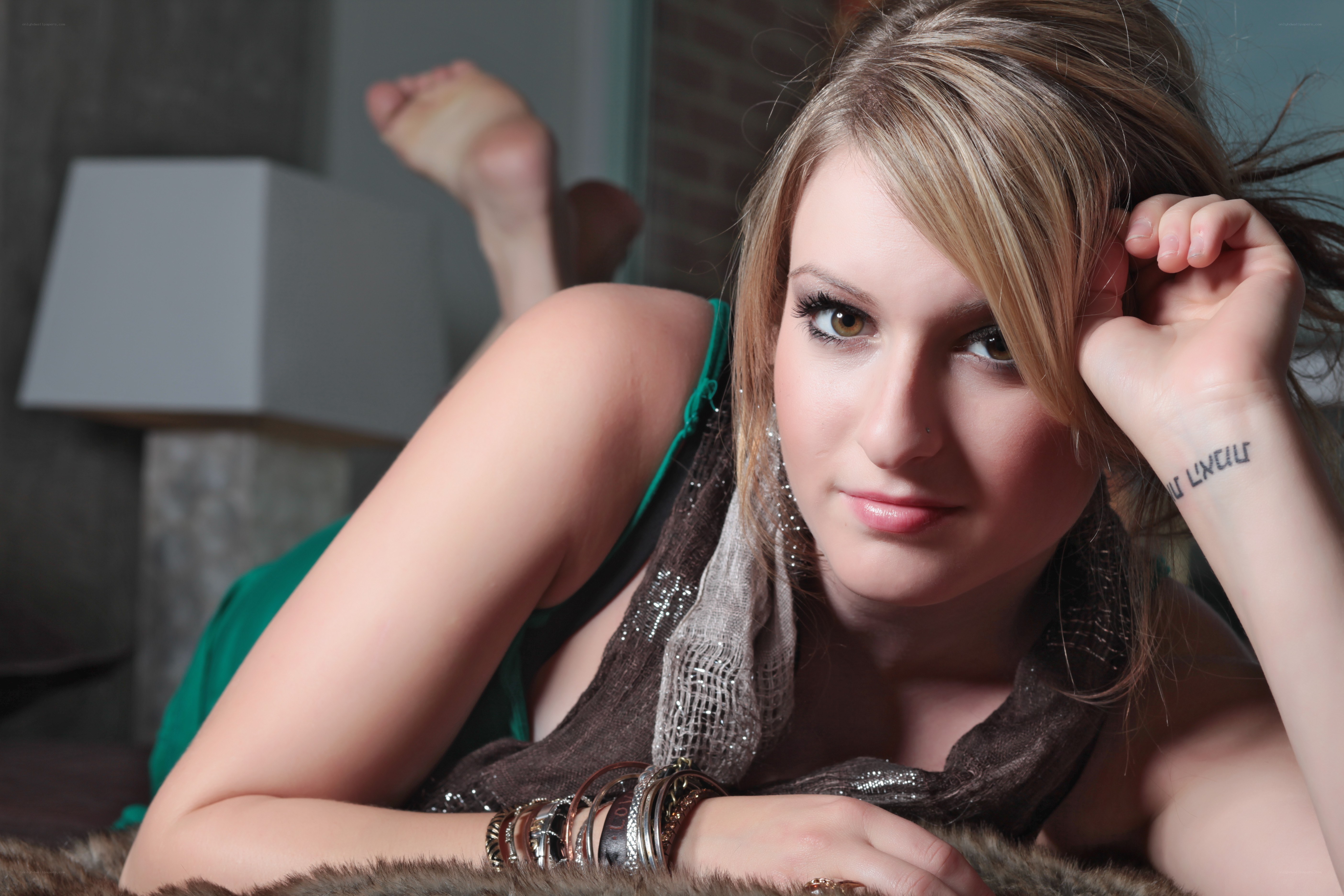 woman with tattoo lying down