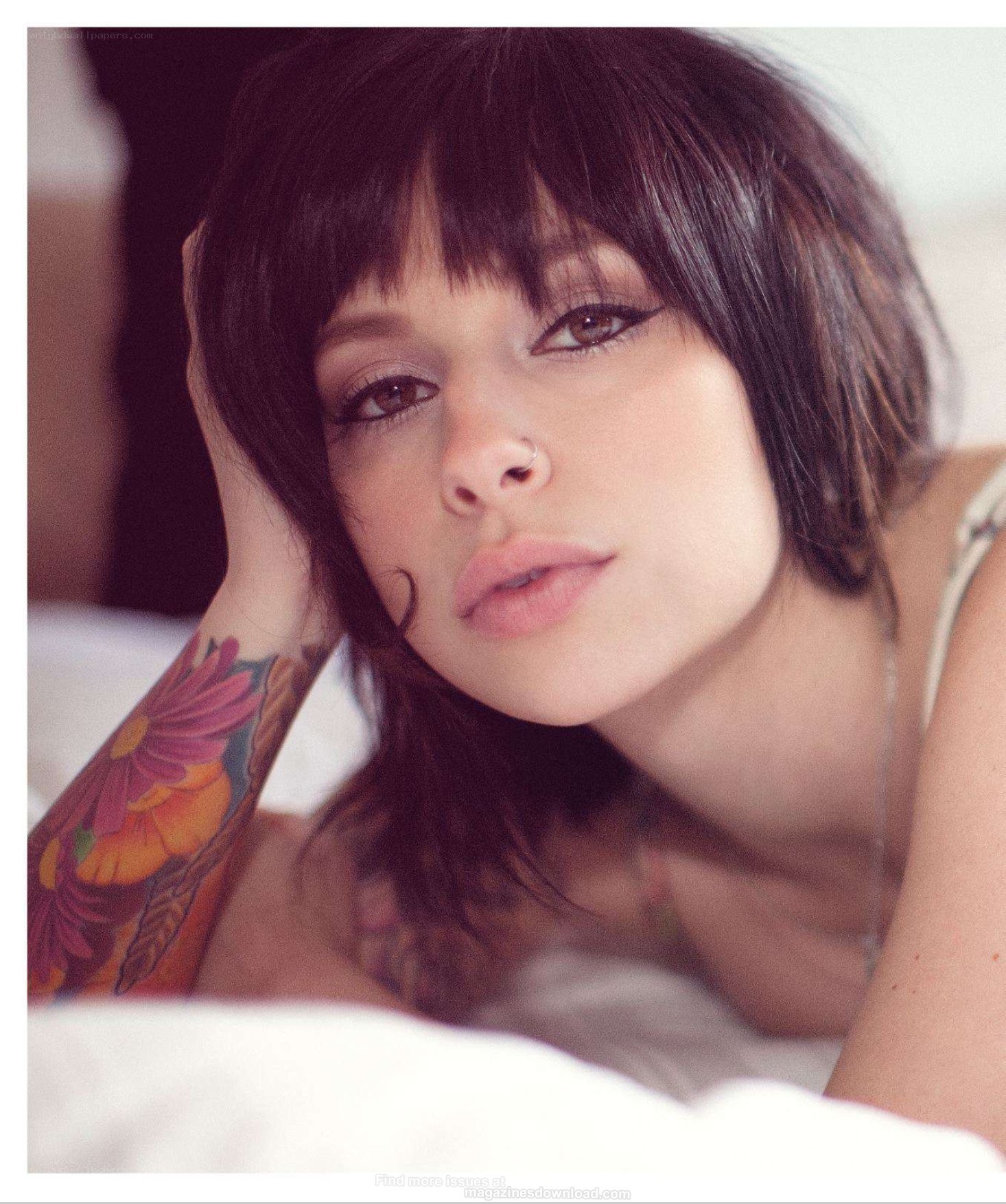 woman with tattoo lying down