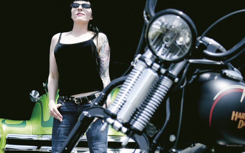 woman with tattoo near motorcycle