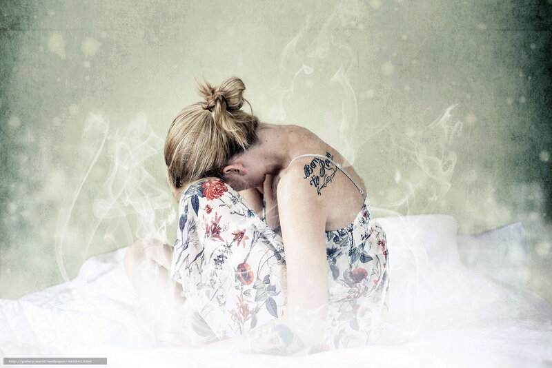 woman with tattoo on bed