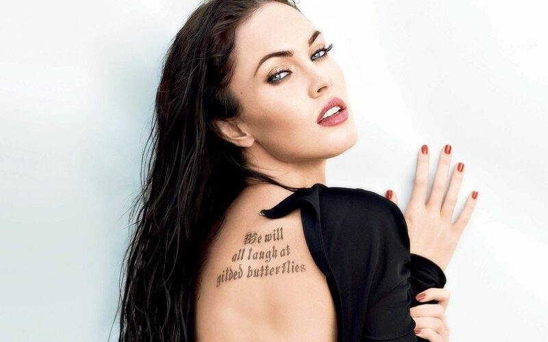 woman with tattoo on shoulder