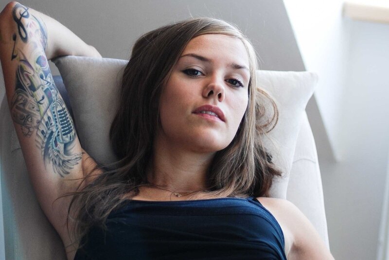 woman with tattoo resting