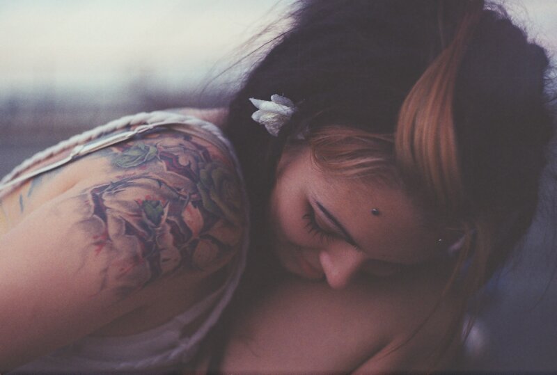 woman with tattoo sleeping