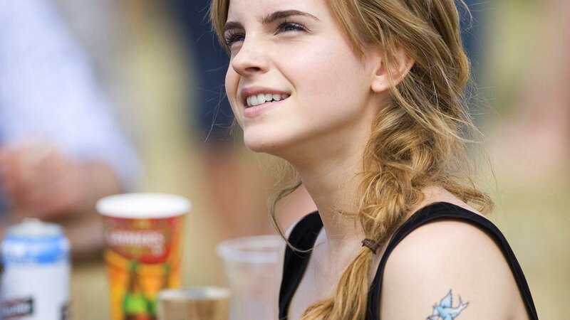 woman with tattoo smiling