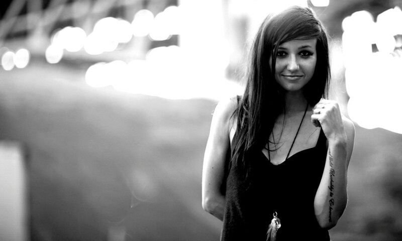 woman with tattoo smiling