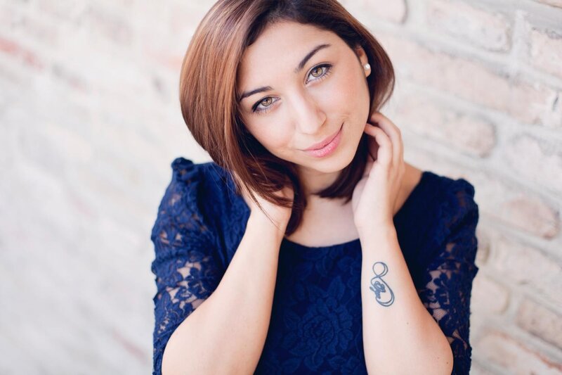 woman with tattoo smiling