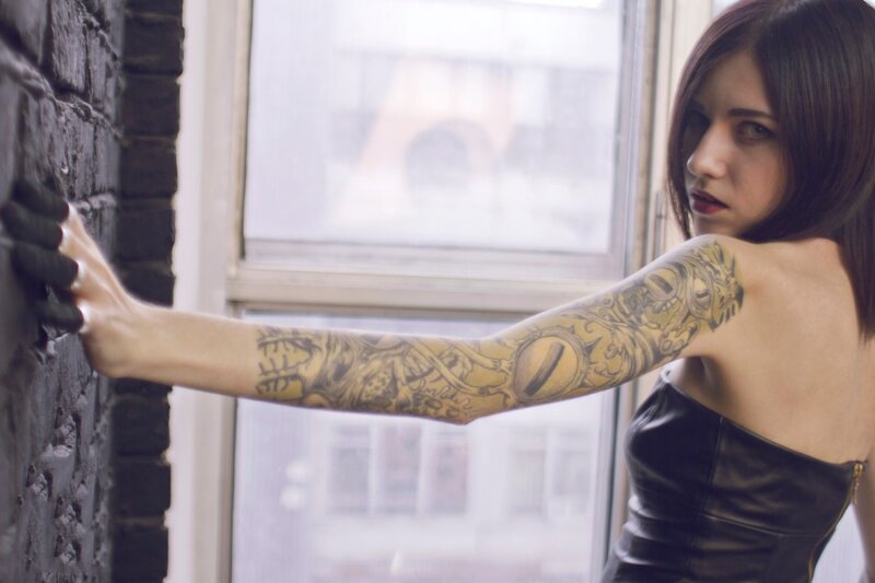 woman with tattooed arm