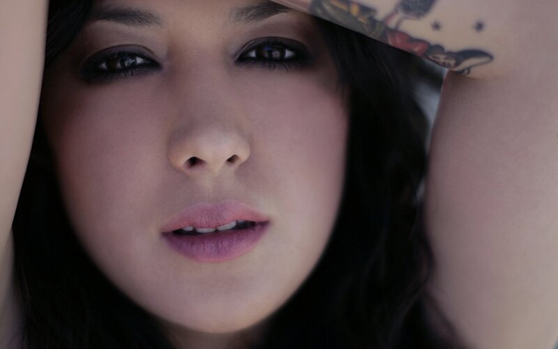 woman with tattooed arm
