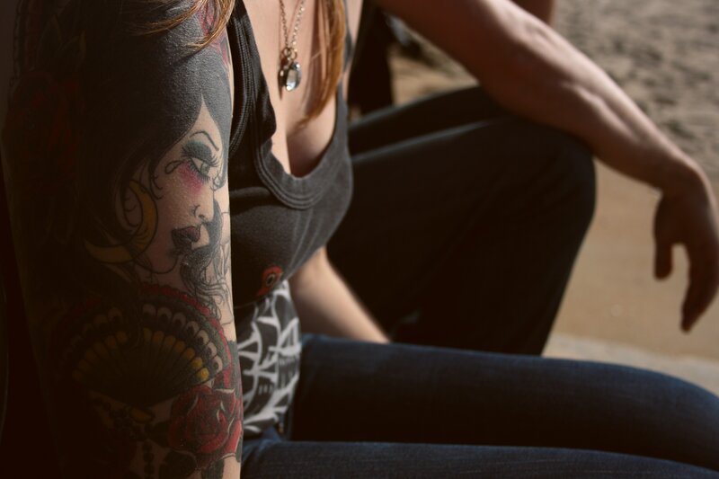 woman with tattooed arm
