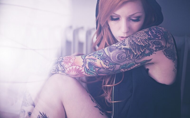 woman with tattooed arm