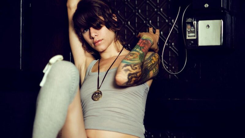 woman with tattooed arm