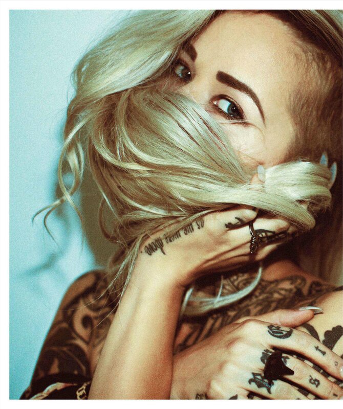 woman with tattoos and blonde hair