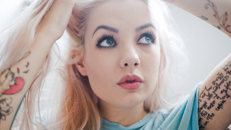 woman with tattoos and blonde hair