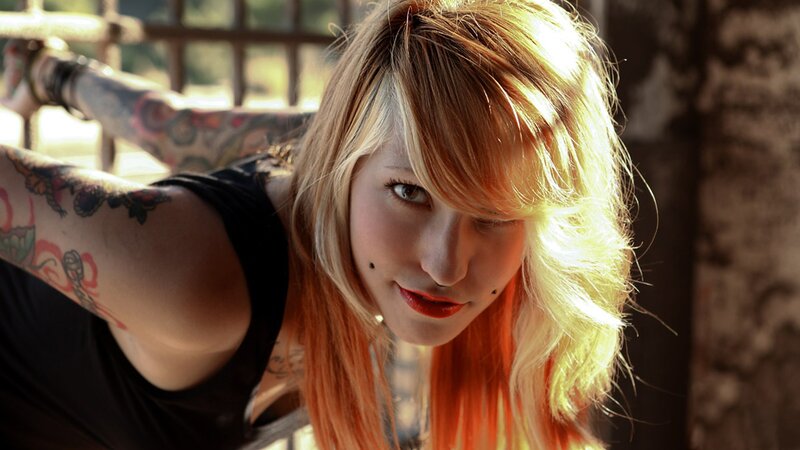 woman with tattoos and blonde hair