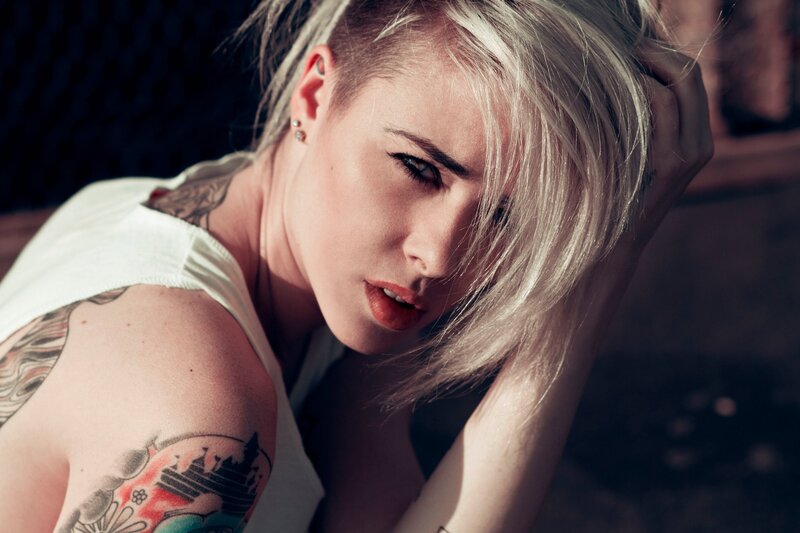 woman with tattoos and blonde hair