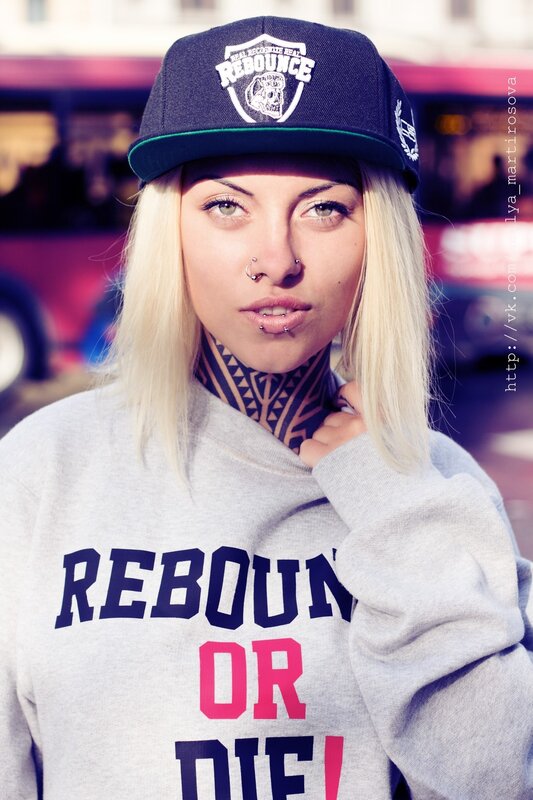 Woman with Tattoos and Cap — Gray