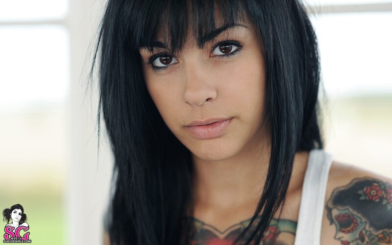 woman with tattoos and dark hair