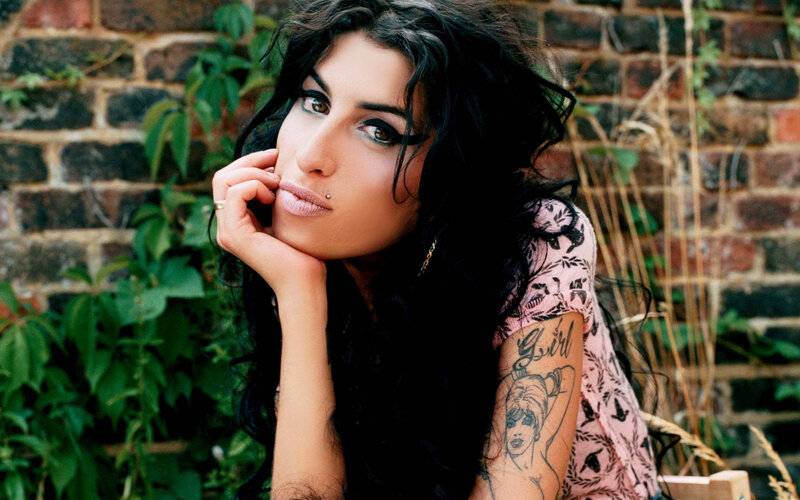 woman with tattoos and dark hair