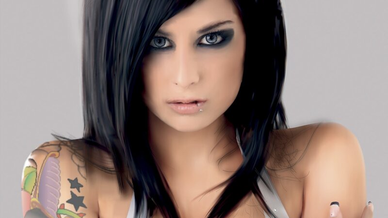 woman with tattoos and dark makeup