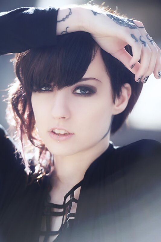 woman with tattoos and dark makeup