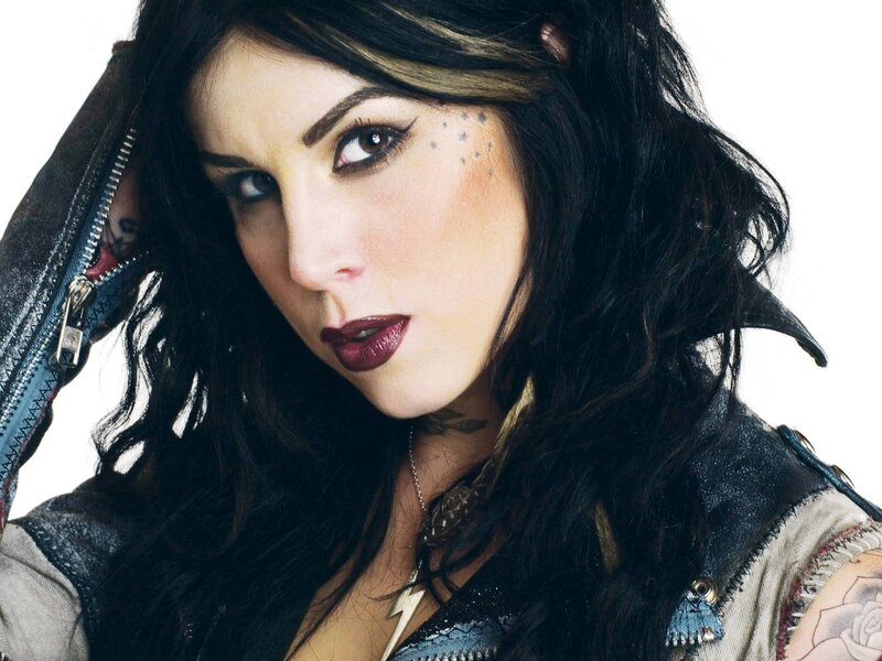 woman with tattoos and dark makeup