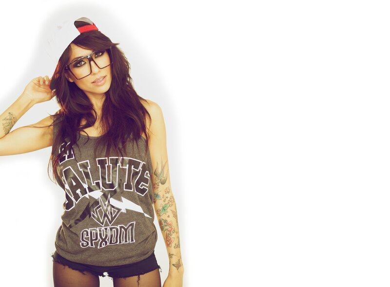 woman with tattoos and glasses