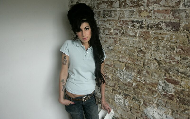 woman with tattoos and high hair
