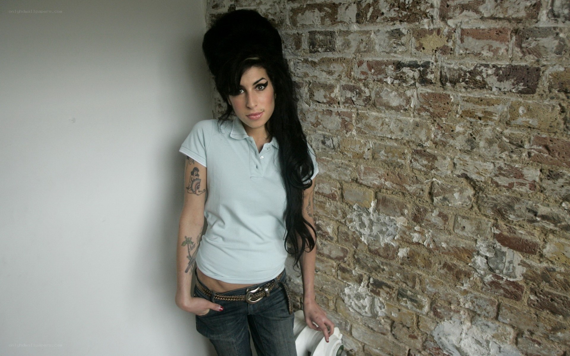 woman with tattoos and high hair