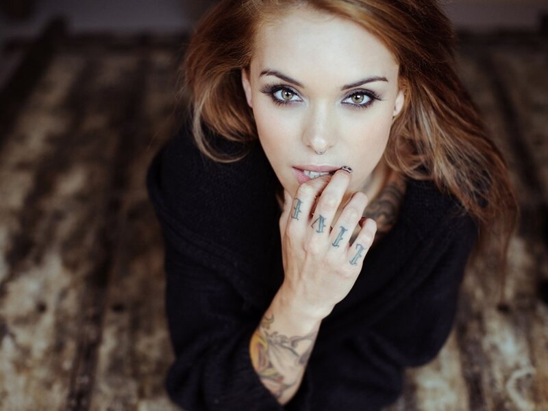 woman with tattoos and makeup