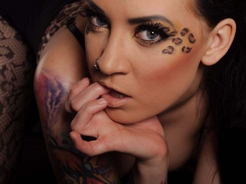 woman with tattoos and makeup