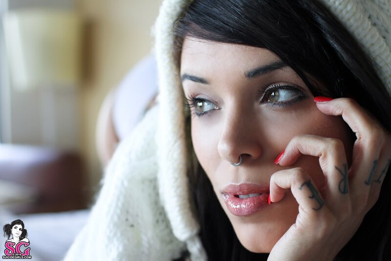woman with tattoos and nose ring