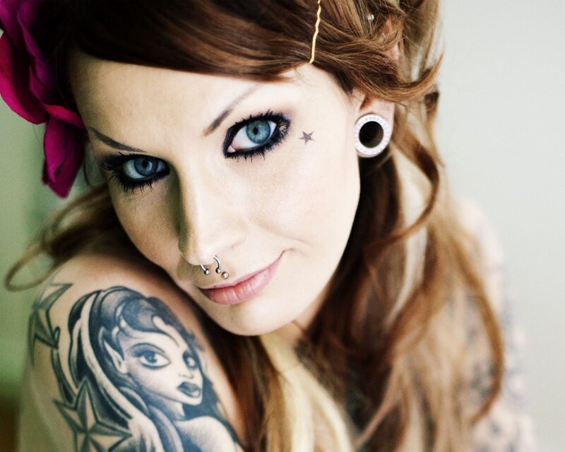 woman with tattoos and piercings