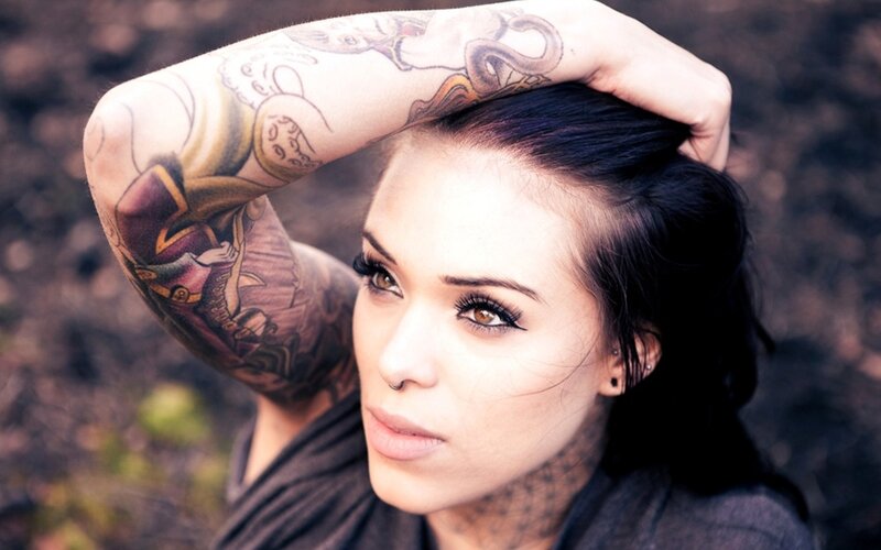 woman with tattoos and piercings