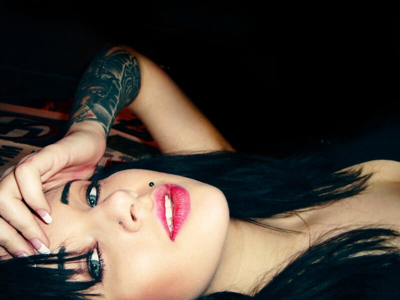woman with tattoos and piercings