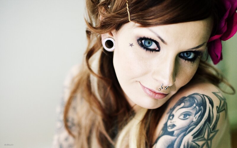 woman with tattoos and piercings
