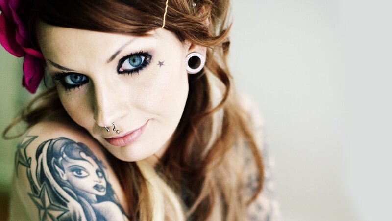 woman with tattoos and piercings