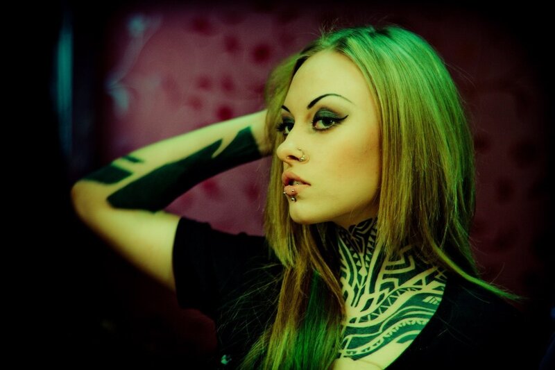 woman with tattoos and piercings