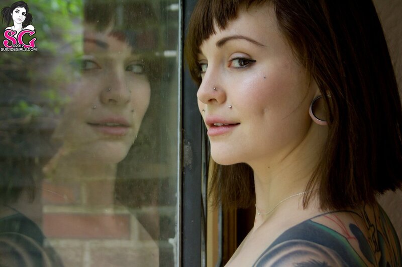 woman with tattoos and piercings